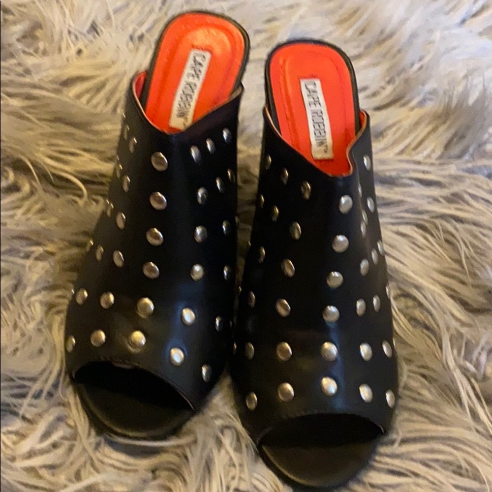 Black and silver clogs